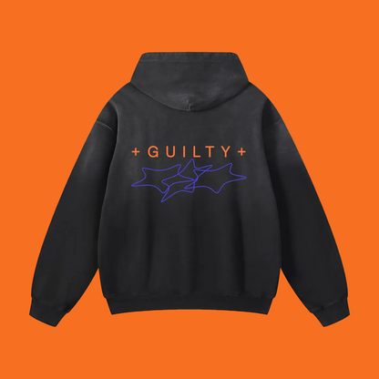 A black pullover hoodie shown from the back, featuring the word “GUILTY” in orange text with purple outline star graphics underneath, displayed on a clean white background.